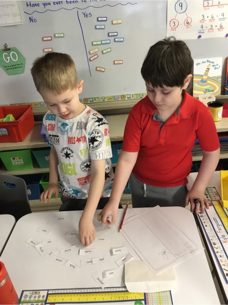 Students working together to create and read compound words