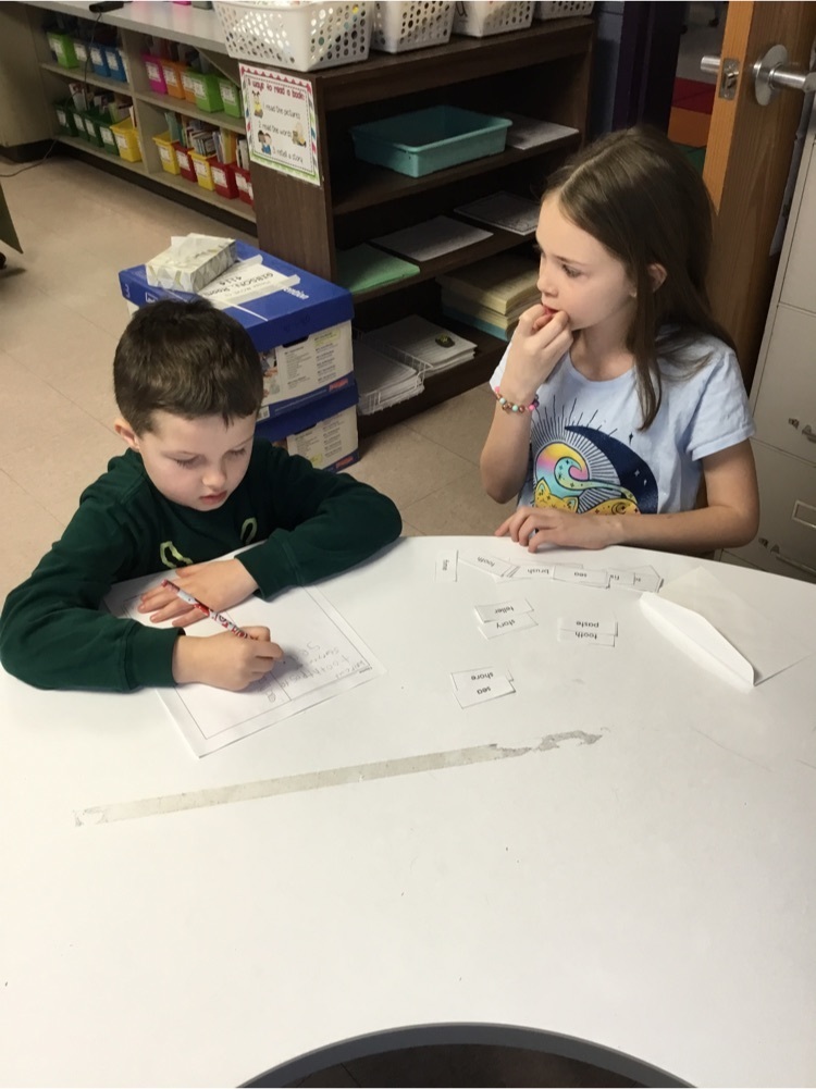 Students working together to create and read compound words.