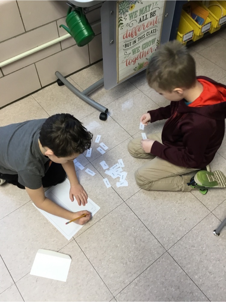 Students working together to create and read compound words.